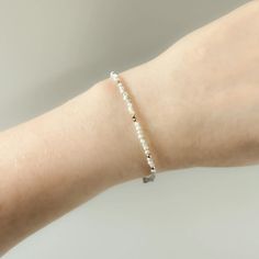 Tiny Mother of Pearl Bracelet Dainty Mother of Pearl Jewelry - Etsy Dainty Stackable Pearl Bracelet, Handmade Dainty Pearl White Bracelets, Delicate Beaded Bracelet For Anniversary, Dainty White Bracelets For Anniversary, Dainty White Bracelet For Anniversary, White Minimalist Beaded Bracelets As Gift, White Minimalist Beaded Bracelets For Gift, Minimalist White Beaded Bracelets For Gift, Minimalist White Beaded Bracelets For Wedding