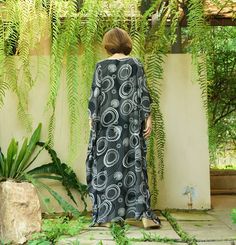 "A soft, comfy, printed light rayon maxi kaftan. A must have piece for this summer. Team this dress with sandal and a big tote to complete a casual chic, or wear it to a garden party, Sunday brunch and beach party. Material: printed light rayon Model is 161 cm. tall with 32\" bust, 28\" waist and 38\" hip Status: ready to ship weight: 315g Measurement: dress (approximately) Width: 43.5\" Bust: 65\" **can fit up to bust max 52\" Hip: 65\" **can fit up to bust max 52\" Length: 52.5\" PLEASE PROVID Black Printed Maxi Dress Free Size, Black Rayon Maxi Dress For Summer, Casual Black Flowy Beach Dress, Vacation Rayon Maxi Dress Relaxed Fit, Casual Rayon Kaftan For Beach, Black Printed One Size Dress, Relaxed Fit Rayon Maxi Dress For Vacation, Casual Summer Rayon Kaftan, Casual Rayon Kaftan For Vacation