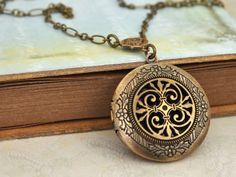 Celtic knot locket in antiqued brass hangs on antiqued brass chain with lobster clasp. No beginning and no ending, the eternity of life. Measurement: Locket is about 1.3 inch (33mm) wide on 18 inch chain. If you have a preferred length for the chain, please let me know in message to seller box and I will adjust it before shipping. Silver plated version listed here, http://www.etsy.com/listing/89558480/the-eternal-knot-celtic-knot-locket?ga_search_query=knot%2Blocket%2B&ga_search_type=user_sh Antique Gold Brass Locket Necklace For Gift, Nickel-free Brass Medallion Locket Necklace, Bohemian Antique Gold Medallion Locket Necklace, Antique Gold Medallion Locket Necklace In Bohemian Style, Antique Gold Bohemian Locket Necklace, Antique Gold Medallion Locket Necklace, Bronze Brass Locket Necklace With Round Pendant, Bronze Antique Locket Necklace, Antique Gold Bohemian Medallion Locket Necklace