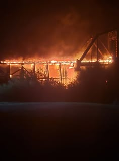 a bridge that is on fire in the night