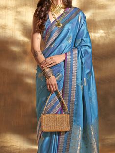 Elevate your traditional look with our beautiful blue zari weaving satin wedding wear saree with blouse. The stunning blue color and intricate zari weaving work make this saree perfect for weddings, festivals, and other special occasions. Made from comfortable satin material, the 5.50 meters saree drapes beautifully, while the matching silk blouse adds an extra touch of elegance.
The saree has a beautiful color that is elevated by the amazing weaving work, creating a stunning and elegant ensembl Festive Blue Art Silk Pre-draped Saree, Blue Pre-draped Saree With Pallu For Wedding, Blue Dola Silk Pre-draped Saree With Pallu, Festive Blue Tussar Silk Pre-draped Saree, Blue Katan Silk Pre-draped Saree With Zari Work, Blue Dola Silk Pre-draped Saree With Zari Weaving, Blue Bollywood Banarasi Silk Pre-draped Saree, Blue Katan Silk Pre-draped Saree, Blue Wedding Pre-draped Saree With Zari Weaving