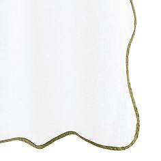 a white sheet with green trim on it