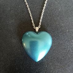 Teal Blue Pearl Color Shift Chameleon Heart Shaped Pendant On 24" Inch Silver Necklace. Handmade With Resin And Color Shift Pigments. New. If You Need The Chain Shorter Just Let Me Know. Blue Heart Necklaces For Party, Blue Heart Beads Necklace In Heart Shape, Blue Heart Beads Heart-shaped Necklace, Blue Heart Beads Heart Necklace, Blue Heart Necklace With Heart Beads Pendant, Blue Heart Pendant Necklace With Heart Beads, Blue Heart Necklace With Heart Beads, Blue Heart Beads Necklace, Long Cross Necklace