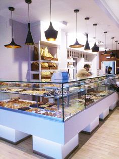 a bakery filled with lots of different types of pastries and desserts on display