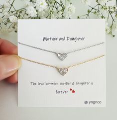 Mother and Daughter Necklace for Mom  Celebrate the lasting connection between a mother and child with this heartfelt heart charm necklace. Featuring a contemporary and dainty design, the necklace showcases a delicate 10mm CZ diamond pendant, gracefully hanging from a refined 16k gold-plated /  rhodium (silver). Versatile for everyday wear, it effortlessly enhances any ensemble with its understated elegance. This charming necklace is an ideal gift for Mother's Day, birthdays for daughters , or any significant occasion to express affection and gratitude. Perfect for not only mothers but also anyone dear to you, including yourself. Customization is available! Add a personalized message to make this gift even more special, creating a treasured keepsake that strengthens your connection with yo Mother's Day Jewelry With Heart Charm For Birthday Gift, Heart-shaped Jewelry For Birthday And Mother's Day, Open Heart Jewelry For Birthday And Mother's Day, Heart Necklace With Hallmark For Birthday And Mother's Day, Heart-shaped Jewelry For Mother's Day Birthday Gift, Heart Shaped Jewelry For Mother's Day Birthday Gift, Meaningful White Necklaces For Mother's Day, Double Heart Jewelry For Birthday And Mother's Day, Heart Necklace With Birthstone For Mother's Day Birthday Gift