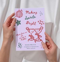 two hands holding up a card that says making spirit bright with red ink on it