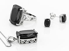 44.39ctw rectangular cushion black spinel rhodium over sterling silver ring, pendant with chain and earrings set. 3.5mm bail. 2" extender. Elegant White Gold Jewelry With Black Spinel, Oval Jewelry With Polished Finish For Evening, Elegant Sterling Silver Jewelry With Black Diamonds, Formal Jewelry With Polished Rectangular Stone, Classic Oval Black Spinel Jewelry, Luxury Black Spinel Jewelry For Formal Occasions, Luxury Black Spinel Jewelry For Formal Events, Elegant Black Spinel Jewelry For Anniversary, Luxury Diamond Cut Rectangular Stone Jewelry