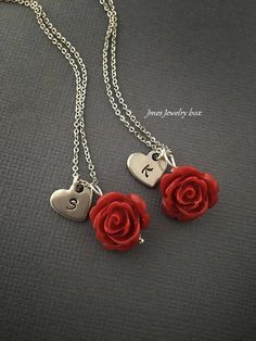 Red rose necklaces with hand stamped initial heart for best friends. Red rose and heart charm are on an 18'' stainless steel chain with lobster clasp. *This price is for 2 necklaces *Stainless steel chain *Stainless steel heart *15mm red rose *Handmade with love <3 Like Jmesjewelrybox on Facebook for updates on new jewelry, upcoming sales and giveaways! Plus Facebook fans save 5% :D Find the coupon code on Jmesjewelrybox's cover photo https://www.facebook.com/Jmesjewelrybox Valentine's Day Initial Pendant Charms Jewelry, Valentine's Day Stainless Steel Necklace, Valentine's Day Charm Necklace With Initial Pendant, Personalized Dangle Charm Necklaces For Valentine's Day, Valentine's Day Dangle Jewelry With Rose Design, Valentine's Day Sterling Silver Rose Jewelry, Valentine's Day Stainless Steel Nickel-free Charm Necklace, Red Stainless Steel Jewelry For Valentine's Day, Valentine's Day Sterling Silver Necklace With Flower Charm