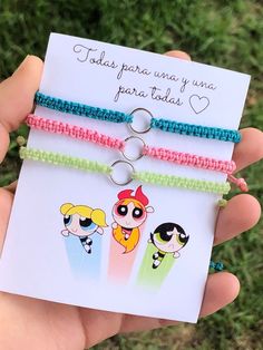 two bracelets with cartoon characters on them