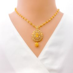 Ganesha Polki Necklace Set - a magnificent piece crafted from 22k Yellow Gold, weighing 27.7 grams, adorned with 6.03 ct of premium uncut diamonds. This exquisite set comes with matching earrings, showcasing the intricate details and beautiful design of this high-fashion statement piece. Lock in your style with the hook lock, and elevate any outfit with this breathtaking set. PRODUCT DETAILS Gold Purity(karat): 22k Item Weight(grams): 27.7 Item Finish: Yellow Gold Stone: Uncut Diamond (Polki) Di 22k Yellow Gold Jewelry Sets For Puja, Elegant 22k Gold Temple Necklace For Puja, Elegant 22k Gold Jewelry Sets For Puja, Gold Diamond Chandbali Necklaces, Gold Kundan Diamond Necklace In Temple Style, Gold Chandbali Diamond Necklaces, Festive Gold Diamond Temple Necklace, Festive Gold Temple Necklace With Diamonds, Elegant Hand Set Temple Necklace For Puja