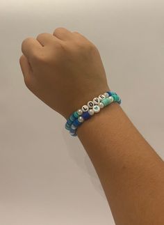 This beautiful bracelet features a lovely combination of blue and green beads, creating a vibrant and eye-catching accessory that is perfect for adding a pop of color to any outfit. Handcrafted with care, this bracelet is not only stylish but also durable, making it a versatile piece that can be worn for any occasion. Add a touch of elegance to your look with this stunning stretchy clay bead bracelet. Trendy Turquoise Round Beads, Blue Stretch Bracelet With Colorful Beads, Casual Turquoise Stretch Bracelet With Colorful Beads, Blue Beaded Bracelets With 8mm Beads For Beach, Adjustable Blue Bracelets With Heart Beads, Adjustable Blue Stretch Bracelet With Heart Beads, Bohemian Blue Friendship Bracelets With 8mm Beads, Blue Friendship Bracelet With Colorful Round Beads, Trendy Turquoise Beaded Stretch Bracelet