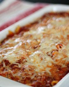 a casserole dish with meat and cheese in it