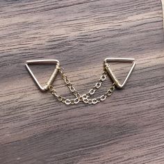 ♥Simply♥Dainty♥Everyday♥Minimal♥ 14k gold filled 14k Rose Gold filled 925 sterling silver Triangle gauge: 24 gauge/0.5mm 22 gauge/0.64mm 20 gauge/0.8mm Triangle inner dimensions: 8x8mm ---------------------------------------------------------- 14k gold filled Anyone who can wear gold can wear gold filled without worries of any allergic reaction to the jewelry. Gold filled jewelry is an economical alternative to solid gold! ---------------------------------------------------------- 100% handmade Dainty Metal Cartilage Earrings, Everyday Triangle Nickel-free Jewelry, Everyday Nickel-free Triangle Jewelry, Gold Minimalist Cartilage Earrings With Delicate Chain, Minimalist Gold Cartilage Earrings With Delicate Chain, Minimalist Metal Cartilage Earrings With Adjustable Chain, Nickel-free Gold Triangle Jewelry, Adjustable Gold Sterling Silver Body Jewelry, Adjustable Triangle Jewelry For Everyday