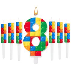 a birthday candle made out of lego blocks with the number eight on it's side