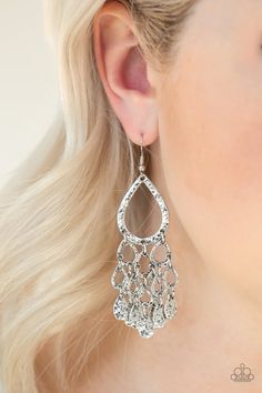 Hammered silver teardrop silhouettes and silver teardrop beads trickle from the bottom of a larger hammered teardrop, creating an edgy lure. Earring attaches to a standard fishhook fitting. Sold as one pair of earrings. Turquoise Stone Jewelry, Teardrop Beads, Paparazzi Accessories, Seed Bead Necklace, Seed Bead Bracelets, Hammered Silver, Fringe Earrings, Beaded Jewelry Diy, Elegant Earrings