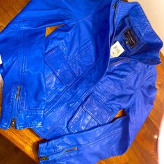 Brand New Electric Blue Leather Jacket. Bought From Lucky Store A Couple Years Ago Because I Thought It Was Super Cute And I Could Eventually Fit In It, But It’s Too Small For Me. Offers Welcome! Blue Biker Jacket With Pockets For Fall, Casual Blue Leather Jacket With Long Sleeves, Blue Casual Leather Jacket, Casual Blue Long Sleeve Leather Jacket, Casual Blue Leather Jacket With Zipper Closure, Fitted Blue Leather Jacket With Pockets, Casual Fitted Blue Biker Jacket, Blue Biker Jacket With Pockets And Long Sleeves, Blue Long Sleeve Biker Jacket With Pockets