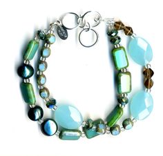 Inspired by sea and sky, this double strand bracelet freshwater pearls, ocean quartz, crystals & Czech glass, with an adjustable sterling silver toggle closure. Adjusts from 7" - 8". Wolf Designs, Beachy Bracelets, Ocean Inspired Jewelry, Jewellery Showroom, Accessory Ideas, Beading Jewelry, Basic Jewelry, Multi Strand Bracelet, Beading Ideas