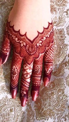 henna tattoo on the palm of a woman's hand