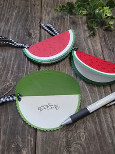 three pieces of paper with watermelon on them