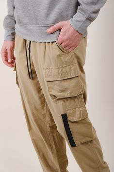 Take your wardrobe from bland to baller with our latest innovation: the Stretch Twill Utility Cargo Pant. Crafted from our top-selling fabric, this style seamlessly blends a timeless workwear aesthetic with modern functionality—without sacrificing comfort and quality. With strategically placed cargo pockets, utility and style collide for a pair of pants you’ll want wear day after day. Our men’s cargo pants have the expected style of multiple, useable pockets down the side of the leg, complete wi Workwear Aesthetic, Jogger Shorts, Cargo Pant, Cargo Pants Men, Mens Outerwear, Pair Of Pants, Top Selling, Hoodie Top, Jogger Pants