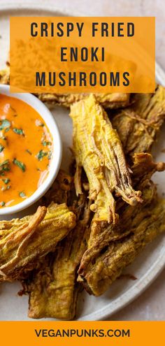 crispy fried enokii mushrooms on a plate with dipping sauce