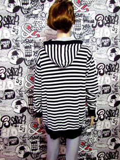 "Womens sweatshirt Vintage ladies sweatshirt Womens pullover black white sweatshirt striped sweatshirt striped pullover hooded Sweatshirt Size L height of the woman in the photo - 180 cm Please refer to photos for details of condition. Condition: used, signs of age and wear see pictures Measurements: Length: 74 cm/ 22.44 \" Shoulder to shoulder: 48 cm/ 24.8 \" Sleeve 67 cm/26.77 \" Bust: 104 cm/42.52\" Waist 102 cm/41\" Hips: 102 cm/ 41\" Size L note The color on the pictures may vary due to mon Trendy Striped Sweater For Streetwear, Sporty Striped Winter Tops, Winter Sporty Striped Tops, Sporty Striped Tops For Winter, Oversized Striped Sweater For Streetwear, Striped Long Sleeve Sweatshirt For Winter, Winter Striped Hoodie With Ribbed Cuffs, Striped Winter Sweatshirt With Ribbed Cuffs, Striped Hoodie With Ribbed Cuffs For Winter