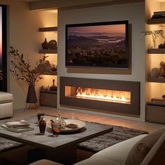 a living room with a fire place in the center and a large window to the outside