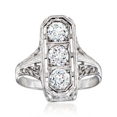 an art deco style diamond ring with three stones in the center, set on a white background