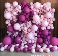 a bunch of balloons that are in the shape of a number on top of each other