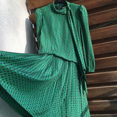 Guy Laroche high neck silk green vintage pleated drop waist dress. Amazing green with tiny geometric print. Pleated / plissee from waist down. Tie front. Buttons on the back. Very good vintage condition. A little bit wrinkled. I don't know exactly the era it's from but should be the 1980s. With shoulder pads. Lined upper part. Zipper on the back in the lining part, buttoned down on the back on the outer fabric. Measurements (item lying flat on the ground, doubled for chest, waist and hips): Leng Green Long Sleeve Vintage Dress For Party, Green Long Sleeve Vintage Party Dress, Retro Green Evening Dress, Green Retro Evening Dress, Vintage Long Sleeve Green Dress, Vintage Silk Pleated Dresses, Elegant Green Midi Vintage Dress, Vintage Green Pleated Dress, 80s Vintage Dress