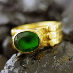 "ARTSMYRNA METAL: 925k Silver GEM: Emerald ( lab created ) Diameter Stone Size: 10x8 mm COATING: 24k gold over (We can made a special type of coating for your personal preference ) MATERIEL : 925K Sterling Silver ( Some of my items vermeil gold over silver for looks rich . But i can finish in silver too ) RING SIZE: 6 (your desired size is made) GEM FEATURES AND BENEFITS Features : It is the divine gem of Goddess Venus. It is also known as \"Healer Stone\". It has the ability to maintain emotion Fine Jewelry Green Oval Stackable Rings, Handmade Green Stackable Rings For Gift, Green Oval Bezel Setting Stackable Rings, Green Oval Stackable Rings For May Birthstone, Green Oval Stackable Rings With Bezel Setting, Green Oval Stackable Rings, Modern Green Stackable Rings, Modern Green Gemstone Stackable Rings, Elegant Handmade Stackable Rings May Birthstone