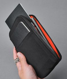 Store your travel essentials efficiently with our all-in-one Zip Travel Wallet. Zip it up to keep your passports, travel documents, and cards from falling out. Just tuck your flight tickets in the front slip pocket, and you’ll be ready to board the plane. And it has RFID protection to ensure your personal information stays secure no matter where you go.It's compatible with our HUB Ecosystem, allowing you to easily connect it to your backpack strap, sling, or messenger bag for quick access. Keep Travel Wallet Organizer, Travel Documents, Flight Tickets, Passport Wallet, Travel Wallet, Backpack Straps, Travel Wallets, Travel Essentials, Front Pocket