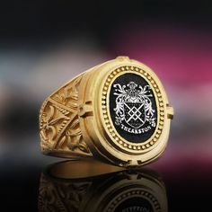 Gold Coated Family Crest Ring Gift, Raised Family Celtic Ring, Coat of Arms Ring, Personalized Signet Ring, Customized Ring, Crest Ring Gift Product Details: ✅Material: 925 Sterling Silver, Gold Coating,  Black Rhodium Coating ✅Ring Size: Available in various sizes (please refer to our sizing chart) ✅Handmade with exceptional craftsmanship ✋🎨 ✅ Dimensions:  21x19mm   /   ±14gr 🛡️ Discover our custom coat of arms jewelry, a symbol of heritage made uniquely yours! 🌟💍 Choose your family crest and let us bring it to life with expert craftsmanship. 🖌️✨ Our artisans create stunning pieces in silver, gold coating, or rhodium coating, tailored to your preferences. 💫🔒 With attention to detail and a touch of elegance, our jewelry collection includes signet rings, pendants, and bracelets, each Luxury 14k Stamped Collectible Signet Ring, Classic Engraved Enamel Ring For Formal Occasions, Classic Engraved Enamel Ring, Luxury Engraved Enamel Ring For Formal Occasions, Fine Jewelry Rings With Certificate Of Authenticity As Gift, Custom Oval Rings For Formal Occasions, White Gold Rings With Certificate Of Authenticity For Gift, Custom Oval Hallmarked Signet Ring, Luxury Ceremonial Rings With Engraving Option