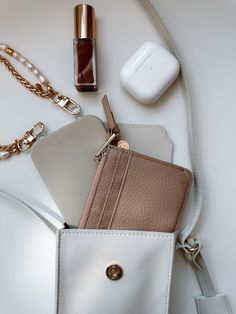 Artfully organize your belongings with THE CÆP's Mate Mini Crossbody. We believe the Mini Mate is the perfect accessory for basically any activity! Crafted with vegan leather, this chic accessory features an adjustable strap (19" min. drop, 23" max. drop), a main compartment that fits all phones with slim cases plus other essentials, an interior back pocket for cards and receipts. Plus, it has a ring for extra clip-on options, magnetic closure, and light gold hardware. Measurements of the Bag: W Chic Accessories, Mini Crossbody, Slim Case, Magnetic Closure, Gold Hardware, Vegan Leather, Adjustable Straps, Off White, Ring