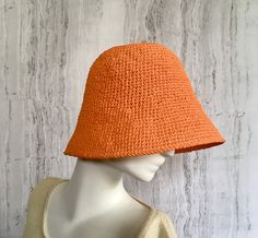 Crochet raffia hat It is a classic accessory for every woman for sun protection, summer parties, beach and travel. Can be a good gift for a woman of any age. The cap is crocheted from natural raffia, light, elastic, the brim of the cap is reinforced with wire. The hat keeps its shape well and does not fade in the sun. The cap is soft to the touch, slightly rough. It is fully crocheted. Easy to carry with foldable design. The hat is perfect for summer wardrobe. Color: Orange Field Size: about 3 inches Care of the product:        It is better to dry the hat naturally, without using additional heating sources. When the raffia product dries, it returns to its original shape.        You cannot wash them in the usual way. If it gets dirty, clean it with soapy water and a sponge. The surface is g Spring Bucket Hat With Short Brim, Handwoven, Spring Handwoven Brimmed Bucket Hat, Handwoven Casual Sun Hat For Summer, Handwoven Summer Bucket Sun Hat, Adjustable Orange Straw Hat For Summer, Casual Handwoven Sun Hat For Summer, Casual Lightweight Toquilla Straw Bucket Hat, Chic Toquilla Straw Bucket Hat, Orange Brimmed Sun Hat For Vacation