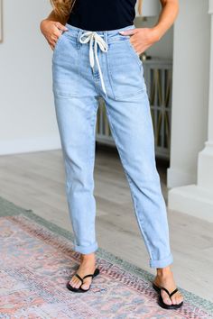 Get a retro-inspired look with our Cooper High Rise Vintage Denim Jogger! This jogger features a high rise design and a light wash for a vintage feel. The self-tie drawstring adds a touch of style, perfect for any casual outing. Judy Blue High Rise Zip Fly Elastic Waistband Functional Drawstring 4-Way Stretch Optional Rolled Cuff 94% Cotton, 5% Polyester, 1% Spandex True to Size, Relaxed Comfort Fit 0/24: Waist 26" Hips 35" Rise 10.5" Inseam 29"1/25: Waist 27" Hips 36" Rise 10.5" Inseam 29"3/26: Blue Joggers, Denim Joggers, Judy Blue Jeans, High Rise Denim, Sweater Blouse, Cardigan Jacket, Retro Inspired, Vintage Denim, Bottoms Pants