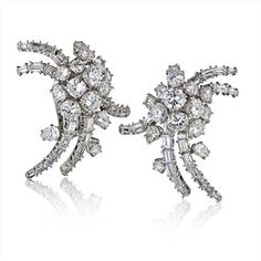 These exquisite French Circa 1960's Platinum 12 Carat Diamond Estate Earrings are a testament to timeless elegance and sophistication. Handcrafted in France, these earrings exude a sense of old-world charm and impeccable craftsmanship.The centerpiece of these earrings is a dazzling 12-carat diamond, radiating brilliance and capturing the light with every movement. The platinum setting adds a touch of luxury and durability, ensuring that these earrings will be cherished for generations to come.Wi Everlasting Love, Platinum Metal, Old World Charm, Estate Jewelry, Old World, Made In France, Types Of Metal, Timeless Design, Timeless Elegance