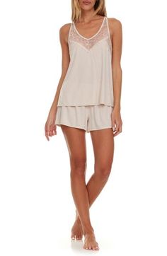 Sleep in the dreamy softness of these lace-trimmed pajamas that pair a flowy cami with matching shorts. 16" top center front length; 2 1/2" inseam; 28 1/2" leg opening; 10" front rise; 13" back rise (size Medium) Top has V-neck; adjustable straps; racerback 62% polyester, 33% rayon, 5% spandex Hand wash, dry flat Imported Short Pajamas, Flora Nikrooz, Hairstyling Products, Rollerball Perfume, Lace Short, Fragrance Design, Pajama Shorts, Styling Tools, Sleepwear Women