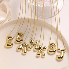 Elevate your style with our Gold Color Chunky Stainless Steel Waterproof Monogram Necklace. Made of durable and trendy stainless steel, this necklace features a bold and eye-catching gold color. Choose your own initial to add a personal touch and make a statement. A perfect gift for yourself or a loved one. Initial Letter Necklace, Bubble Design, Bubble Letter, Letter Jewelry, Letter Pendant Necklace, Initial Necklace Gold, Letter Balloons, Waterproof Jewelry, Monogram Necklace