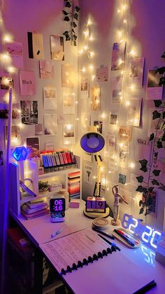 a desk topped with lots of lights and a clock on top of it's side