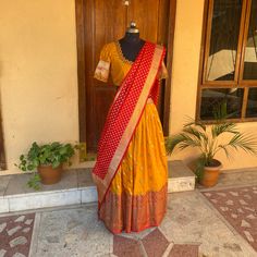 Wedding lehenga choli/ lehenga set with dupatta / teens lehenga/ bridal lehenga/ kids lehenga Indian banarasi half saree / crop top lehenga/ lehenga USA / Langa voni / voggish / yellow red lehenga / pattu pavadai Here is a beautiful and traditional Indian banarasi katan silk lehenga in mustard yellow color with red color border combination is a stunning piece for your upcoming parties!! It's a 3 piece set that includes skirt , hand embroidered blouse and red banarasi dupatta, please find the det Navratri Floor-length Dola Silk Pre-draped Saree, Unstitched Anarkali Choli With Self Design, Semi-stitched Banarasi Silk Dress With Pallu, Festival Anarkali Lehenga With Zari Work, Anarkali Lehenga With Zari Work For Festivals, Bollywood Banarasi Silk Floor-length Sets, Floor-length Choli With Unstitched Blouse For Diwali, Floor-length Self Design Choli For Diwali, Diwali Floor-length Choli With Unstitched Blouse