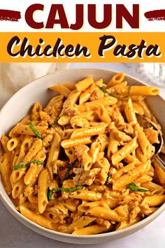 a white bowl filled with chicken pasta and garnished with parsley