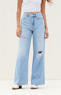 Medium Indigo Ripped Wide Leg Jeans Edgy Wide Leg Flare Jeans With Relaxed Fit, Edgy Wide Leg Jeans With Relaxed Fit, Trendy Wide Leg Flare Jeans With Zipper Closure, Trendy Wide-leg Jeans With Frayed Hem, Wide Leg Jeans With Zipper Closure For Spring, Spring Wide Leg Jeans With Zipper Closure, Wide Leg Jeans With Zipper For Spring, Edgy Distressed Wide Leg Bottoms, Edgy Wide Leg Distressed Bottoms