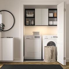 a white washer sitting next to a dryer in a room