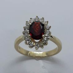 This stunning vintage style ring has been carefully crafted from scratch in 10k Solid Yellow Gold,  authentic garnet stone and authentic Diamonds. Great for any occasion! Buy it for your-self or for someone you love! This beautiful ring will not go unnoticed. All of my jewelry is handmade from scratch and of high quality. A tracking shipping number will be provided to you once ring has been mailed. Ring Measurements and Materials: Ring is size 6 1/2 but can be resized at no extra cost and will b Classic Ruby Cluster Ring With Gemstone, Classic Red Oval Cluster Ring, Classic Red Cluster Ring, Red Cluster Ring Stamped 14k, Red 14k Stamped Cluster Ring, Classic Red Birthstone Ring With Center Stone, Classic Garnet Diamond Ring With Center Stone, Heirloom Red Cluster Ring With Prong Setting, Classic Burgundy Ruby Ring