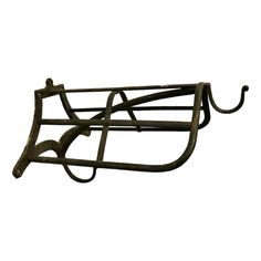 a metal rack with two hooks attached to it