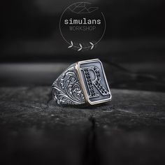 Elevate your style with our customizable initials sterling silver men's ring, meticulously designed to combine timeless elegance with a personal touch. Crafted from high-quality 925 sterling silver, this ring features a rectangular design adorned with intricate engravings, showcasing the art of gravure. Material: 925 Sterling Silver Design: Rectangular format with customizable initials or monograms Details: Embellished with black micro stones for a sophisticated finish Finish: Antique finish for Formal Black Engraved Ring With Engraving Option, Black Engraved Ring For Formal Occasions, Elegant Black Rings With Initials, Classic Black Signet Ring With Initials, Black Sterling Silver Signet Ring With Engraving Option, Timeless Silver Initial Ring, Silver Engraved Ring With Initials For Formal Occasions, Timeless Sterling Silver Engraved Initial Ring, Classic Black Initial Ring For Formal Occasions