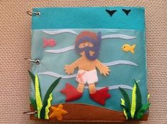 a paper cut out of a man in the ocean with fish and seaweed on it