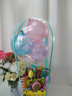 an easter basket with balloons and candy