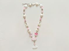 A pink and white necklace with a pearlescent cloud pendant, pink glass butterflies and flowers. With pearl butterflies, hearts and flowers.  Length - 42cm / 16.5" with a 4.5cm / 1.7" extender Coquette Aesthetic Pink, Glass Butterflies, Cloud Pendant, Butterfly And Flower, Hearts And Flowers, Butterflies And Flowers, Coquette Pink, Glass Butterfly, Aesthetic Pink